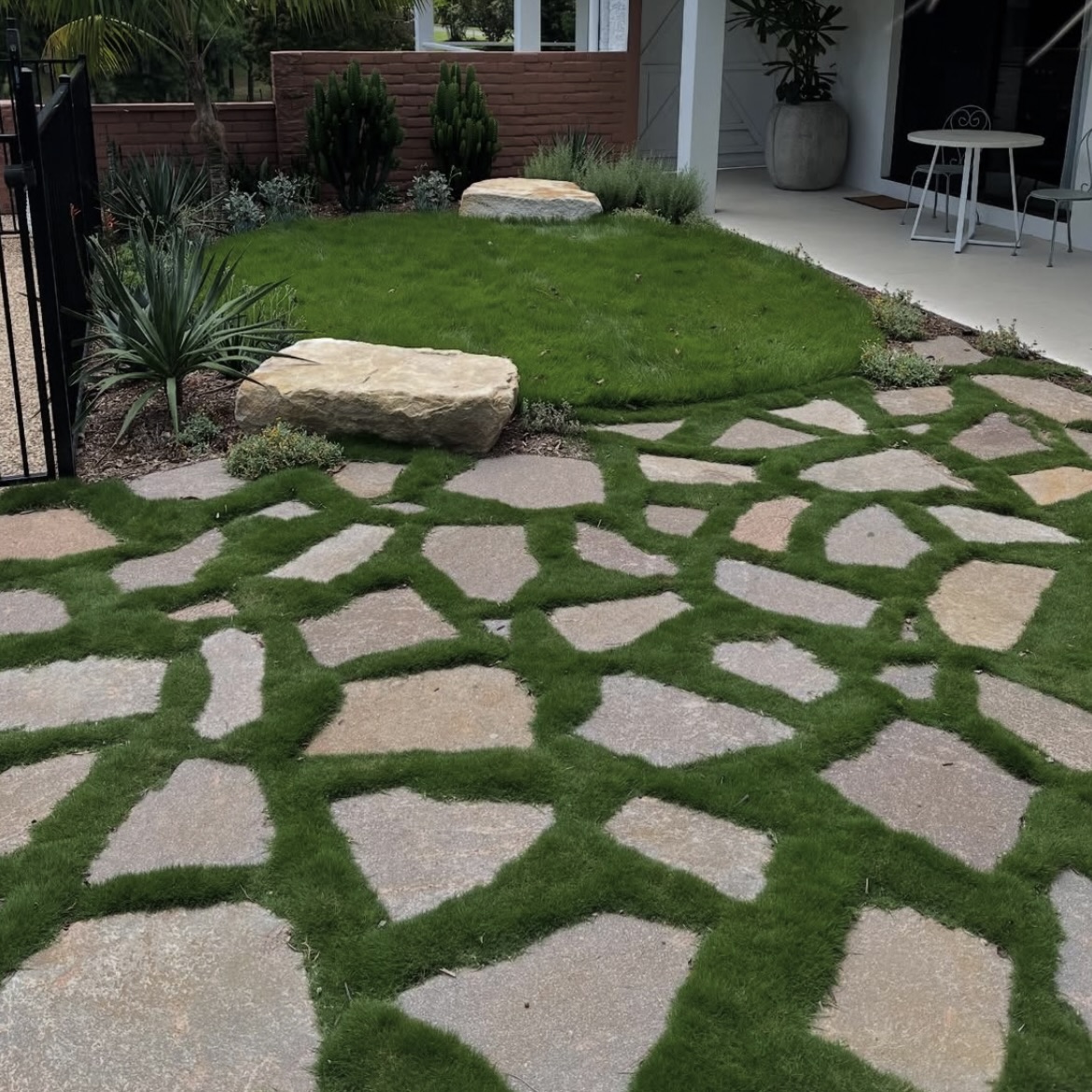 Stepping stones set into a new Coastal Turf lawn
