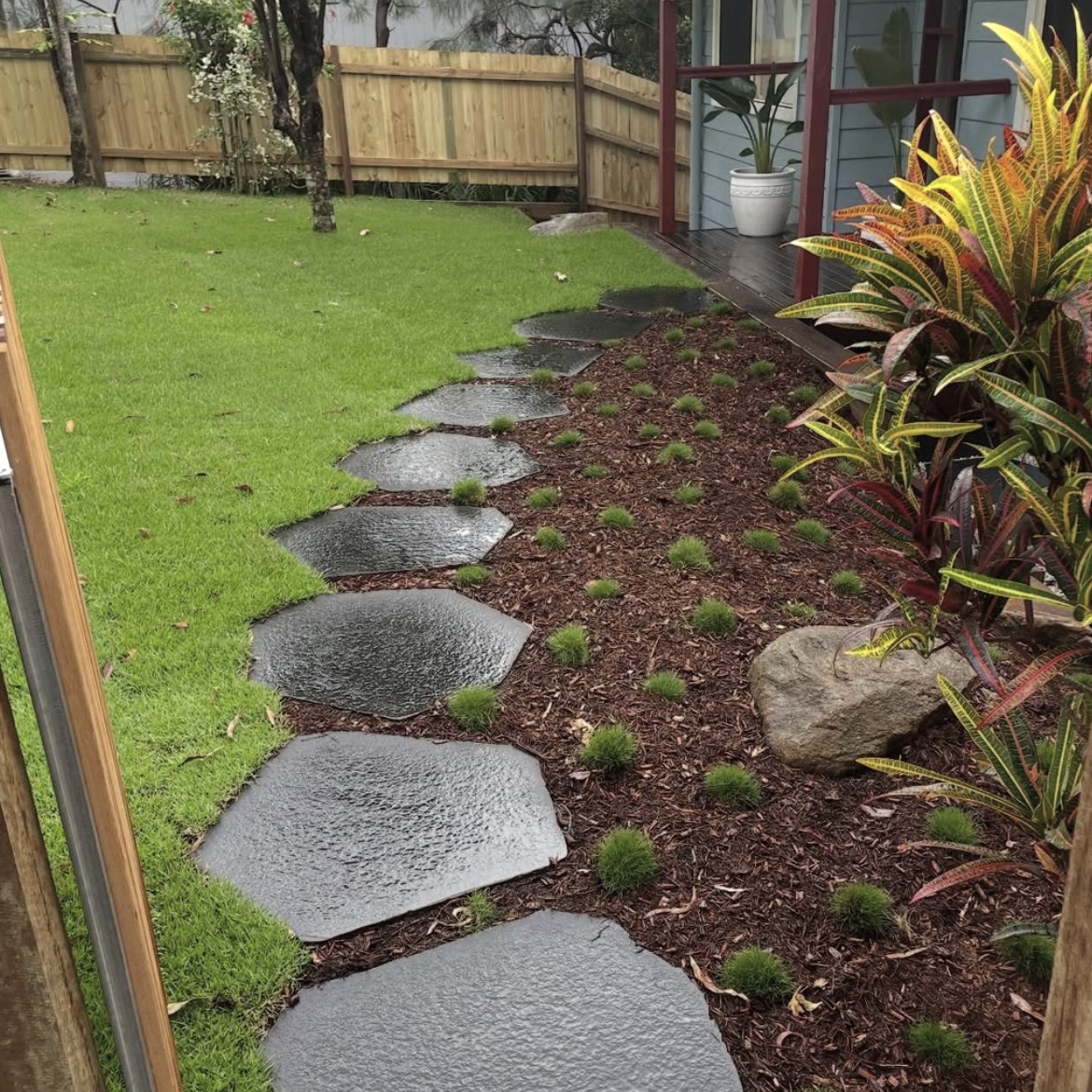 Side path and garden bed with new turf